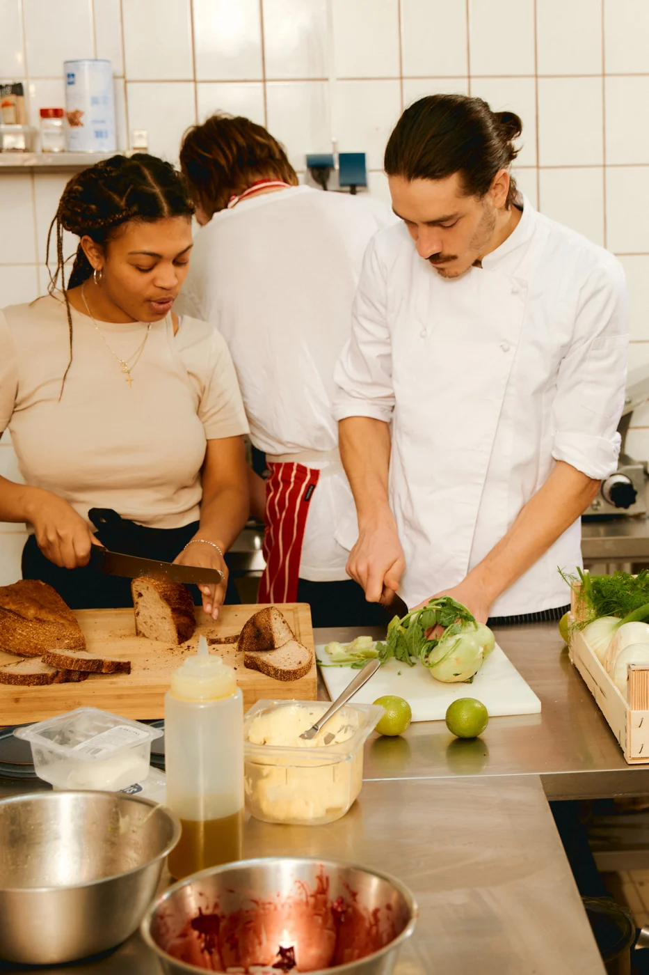 People preparing food together in a kitchen